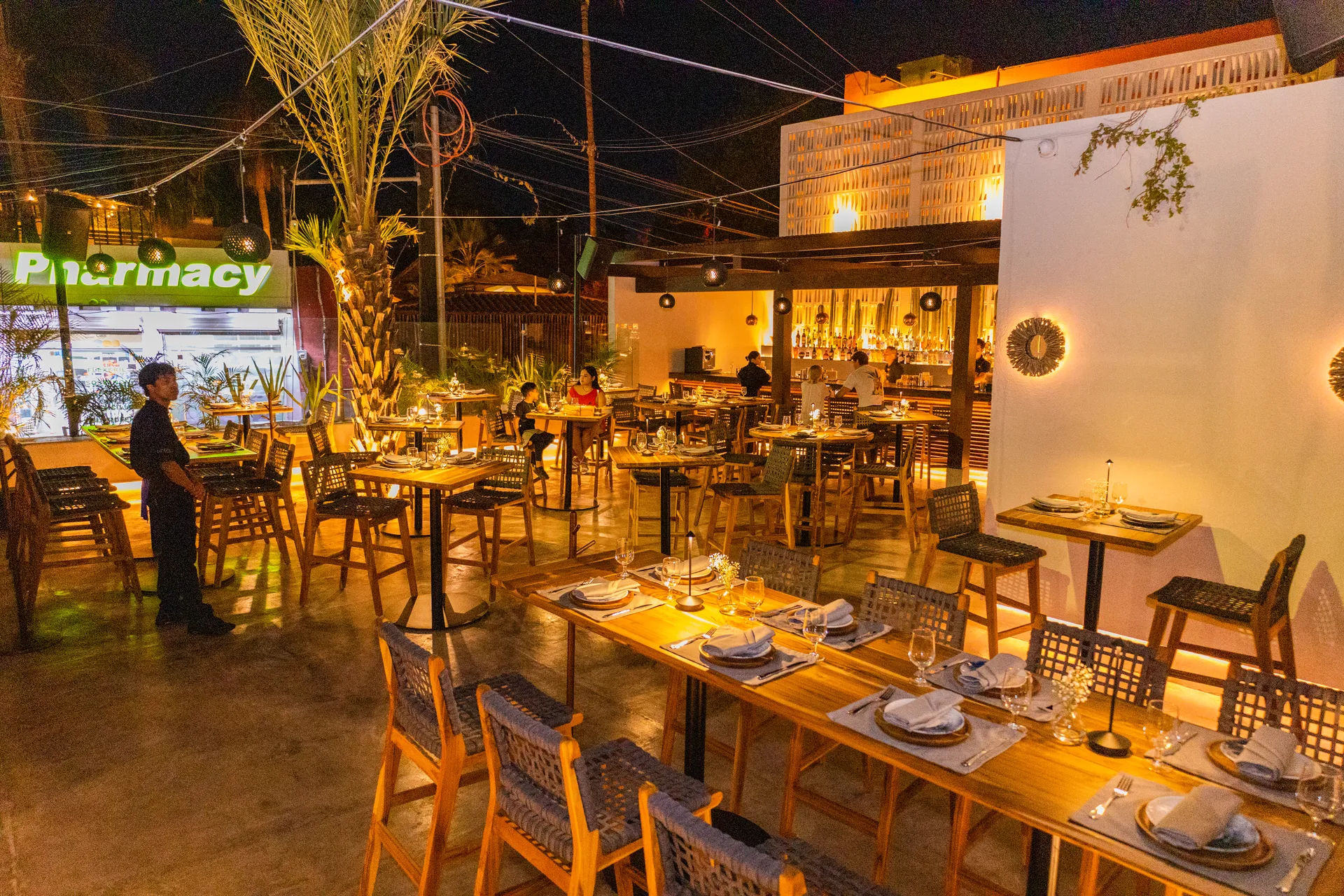 Night view of N'TRE Cocina al Fuego restaurant in Cabo San Lucas